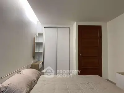 Cozy bedroom with modern design and ample storage space