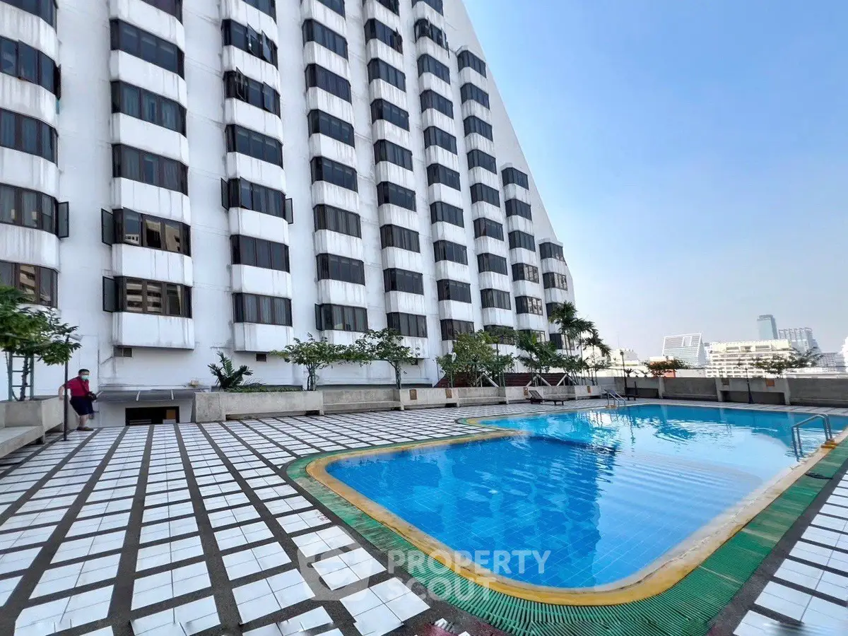 Stunning rooftop pool with city views in modern high-rise building