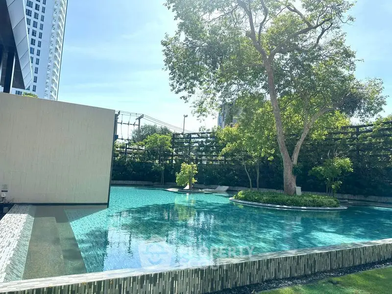 Luxurious outdoor pool with lush greenery and modern design