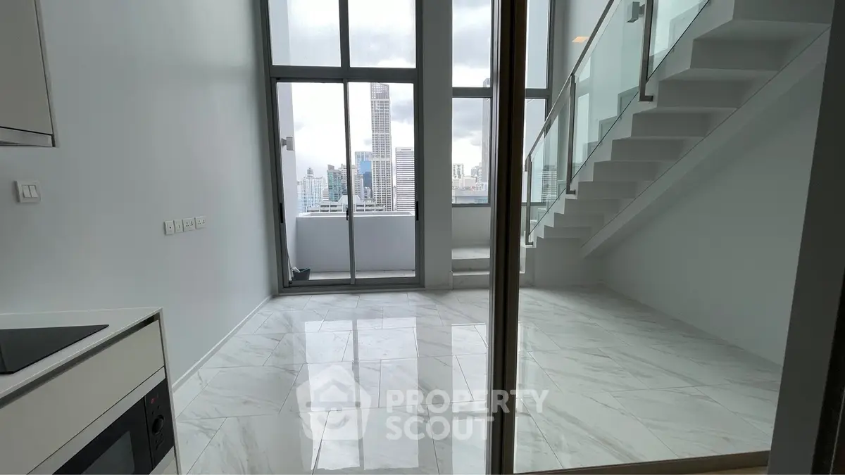 Modern duplex apartment with floor-to-ceiling windows and city view