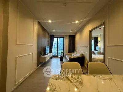 Modern living room with elegant decor and city view balcony