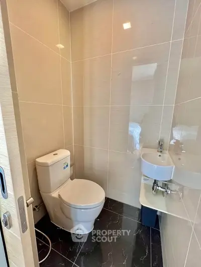 Modern bathroom with sleek design and compact fixtures