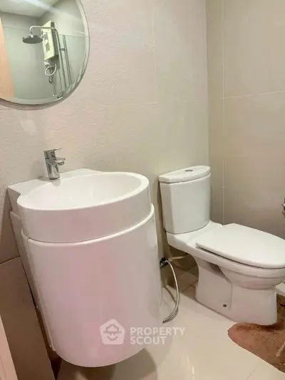 Modern bathroom with sleek white fixtures and minimalist design