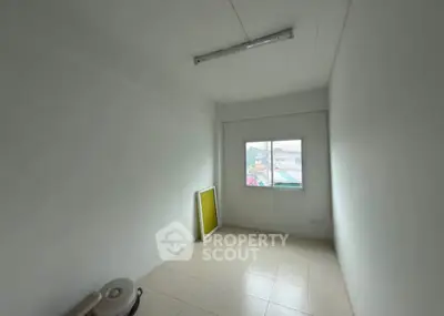 Minimalist empty room with window and tiled floor, ideal for customization.