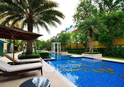 Luxurious outdoor pool area with elegant design and lush greenery, perfect for relaxation and leisure.