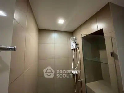 Modern bathroom with sleek shower design and glass partition