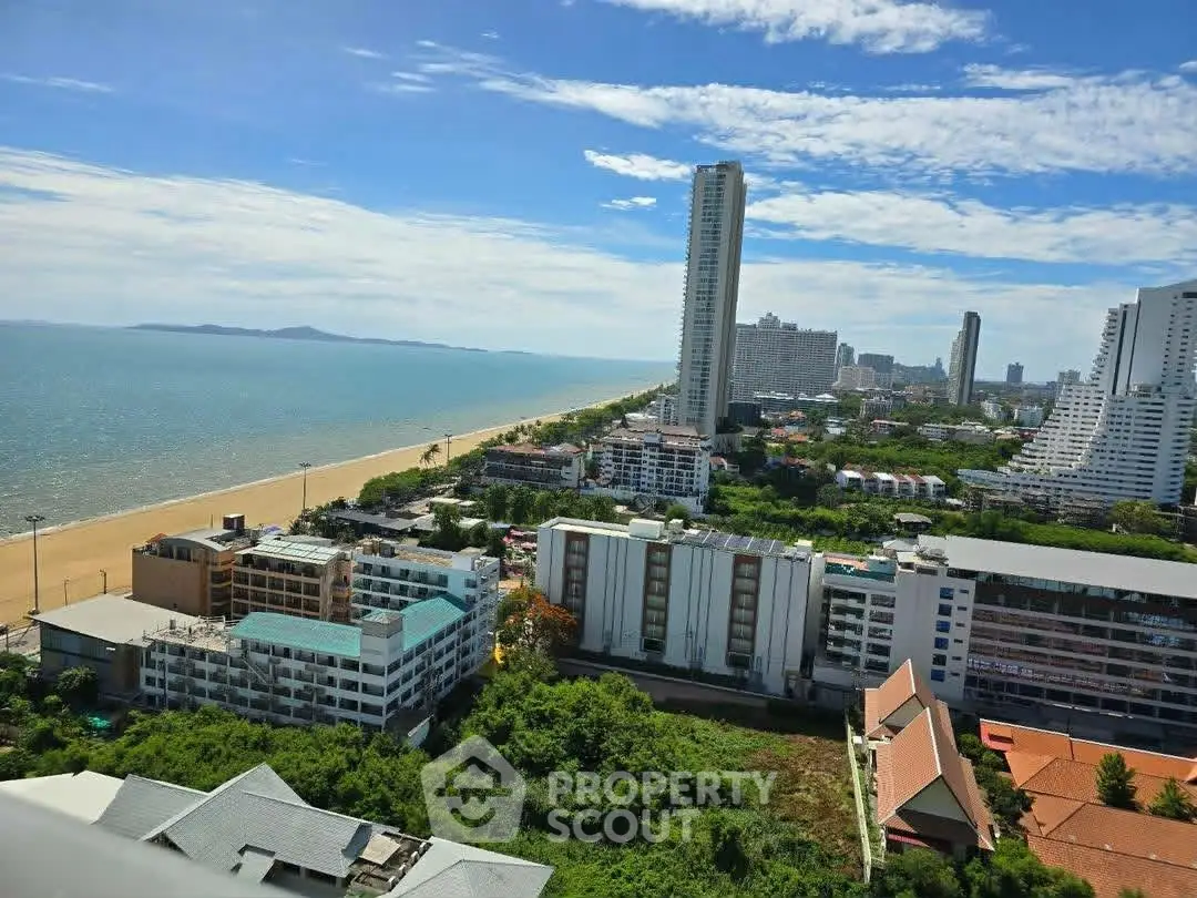 Stunning beachfront view from high-rise condo with panoramic ocean and cityscape vistas.
