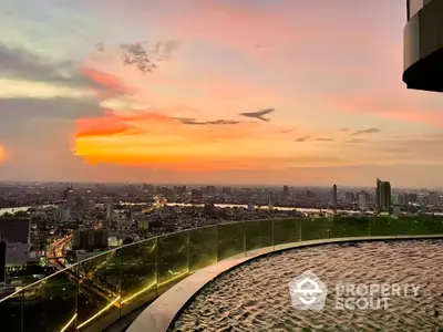 Stunning rooftop pool with panoramic city skyline view at sunset