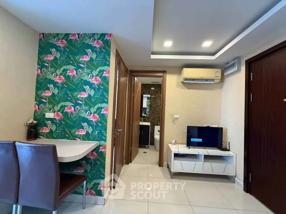 Chic modern living room with vibrant flamingo wallpaper and sleek furniture
