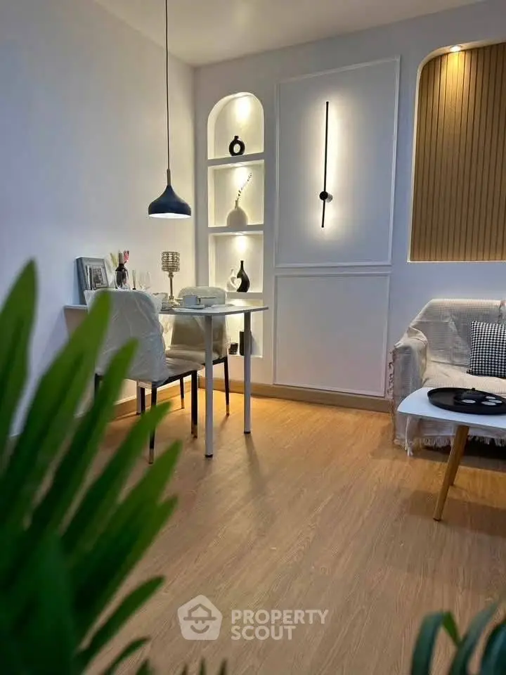 Stylish modern living room with elegant decor and cozy seating area.