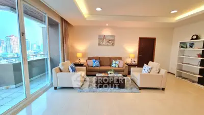 Spacious living room with modern decor and city view balcony