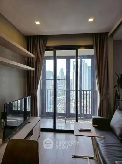 Modern living room with city view, featuring sleek furniture and floor-to-ceiling windows.