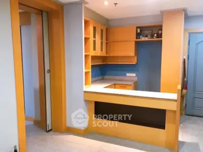 Charming kitchen with open layout and wooden cabinetry, perfect for modern living.