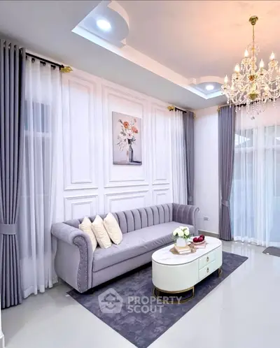 Elegant living room with luxurious chandelier and stylish decor