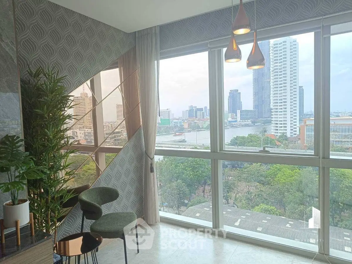 Stunning high-rise apartment with panoramic city and river views, featuring modern decor and floor-to-ceiling windows.