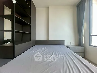 Modern bedroom with sleek design and ample natural light