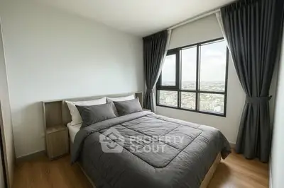 Modern bedroom with large window and stylish gray bedding