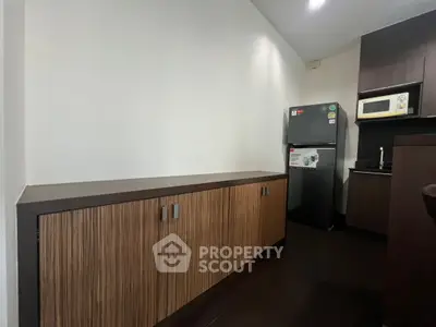 Modern kitchen with sleek cabinetry and appliances in a stylish apartment.