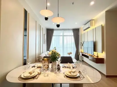 Elegant modern living room with dining area and stylish decor