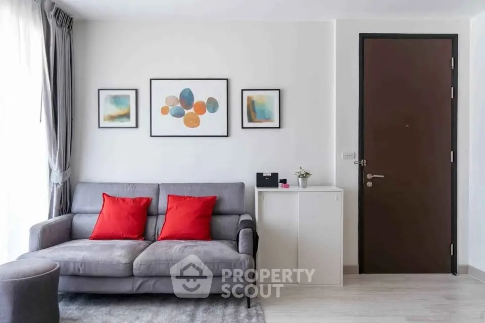 Modern living room with stylish sofa and contemporary art decor.