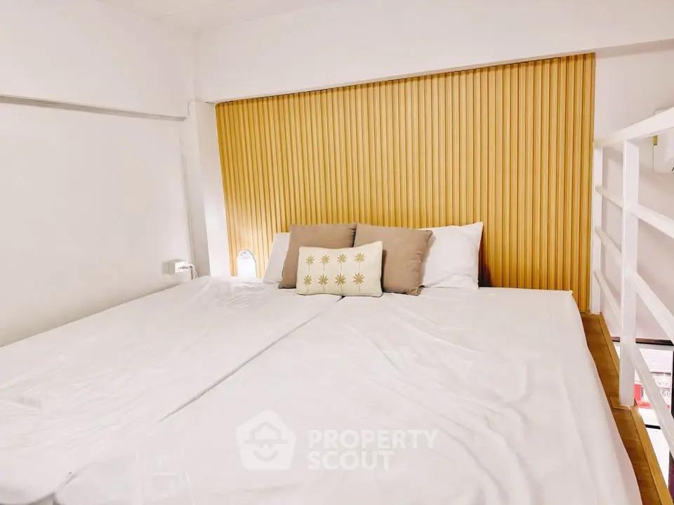 Cozy bedroom with modern design and comfortable bedding