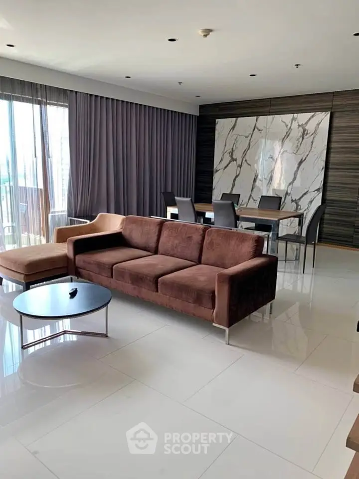 Luxurious modern living room with elegant marble accents and plush seating