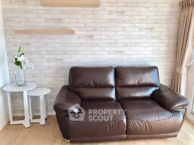 Stylish living room with leather sofa and modern decor