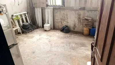 Spacious storage room with potential for renovation and customization.