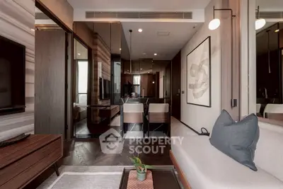 Modern living room with stylish decor and open layout, featuring elegant furniture and contemporary artwork.