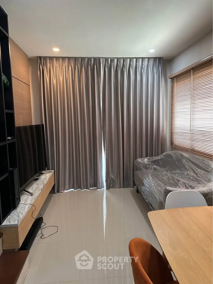 Modern living room with sleek curtains and cozy furniture