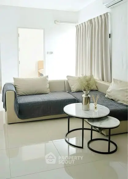 Modern living room with sleek sofa and stylish coffee table