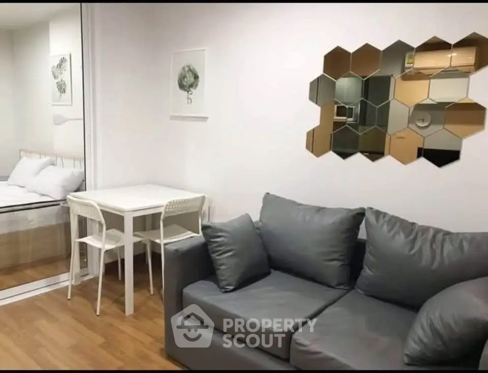 Modern living room with stylish decor and cozy seating in a contemporary apartment.