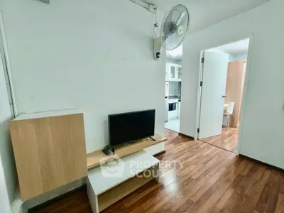 Cozy apartment interior with wooden flooring and modern kitchen view