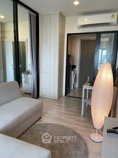 Modern living room with stylish decor and open layout in a contemporary apartment.
