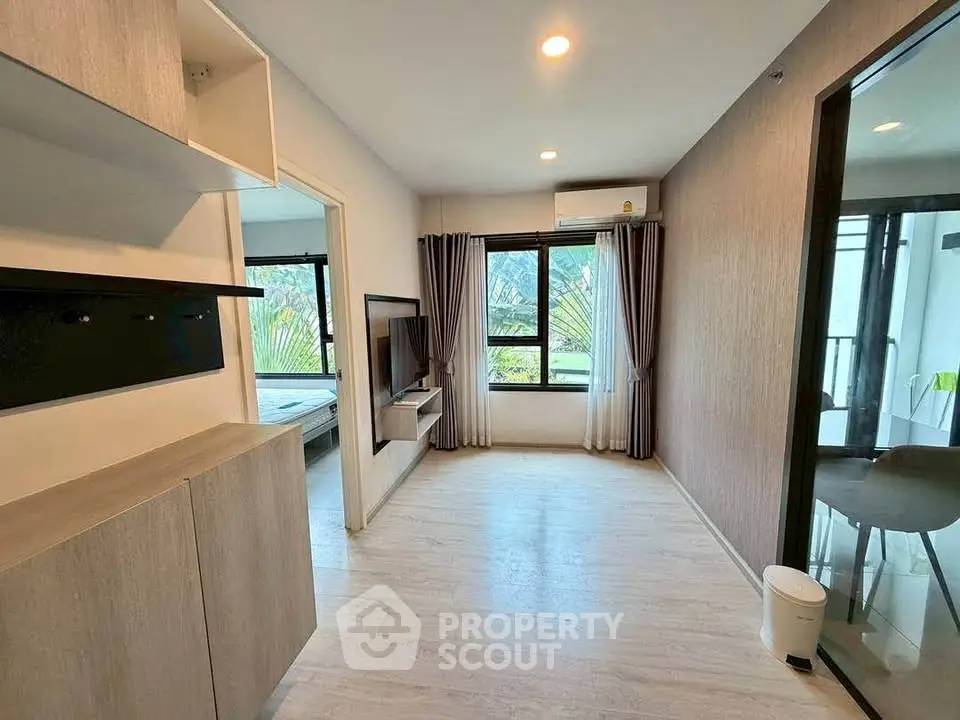Modern living room with natural light and stylish decor in a contemporary apartment.