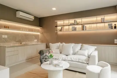Modern living room with elegant decor and built-in shelving