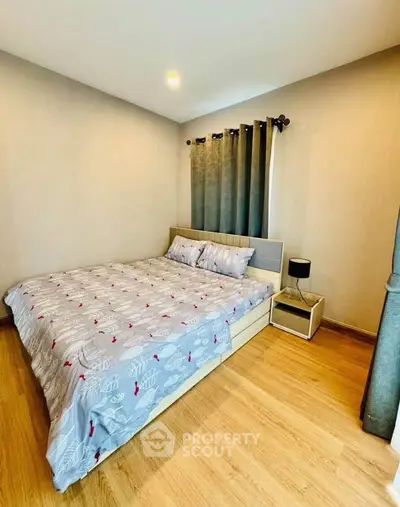Cozy bedroom with wooden flooring and modern decor