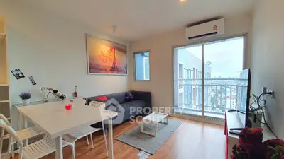 Modern living room with city view, stylish decor, and natural light