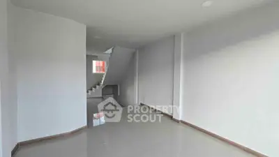 Spacious modern interior with sleek tile flooring and minimalist design, perfect for customization.