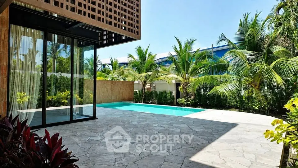 Luxurious tropical villa with private pool and lush garden, perfect for relaxation and entertaining.