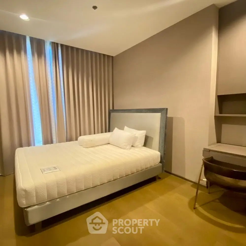 Modern bedroom with stylish decor and natural light