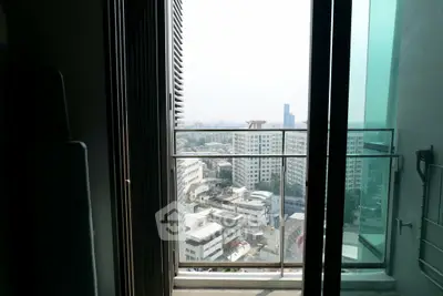 Stunning cityscape view from a high-rise balcony, perfect for urban living enthusiasts.