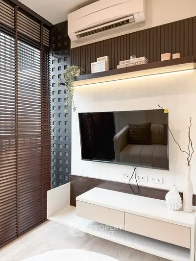 Modern living room with sleek TV setup and stylish decor