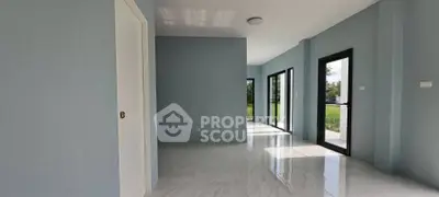 Spacious modern interior with large windows and sleek flooring