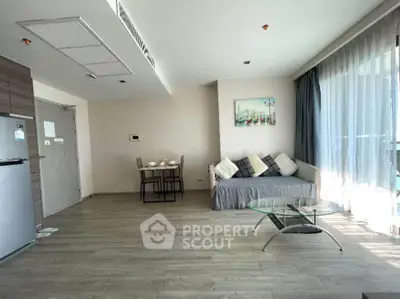 Spacious modern living room with stylish decor and natural light