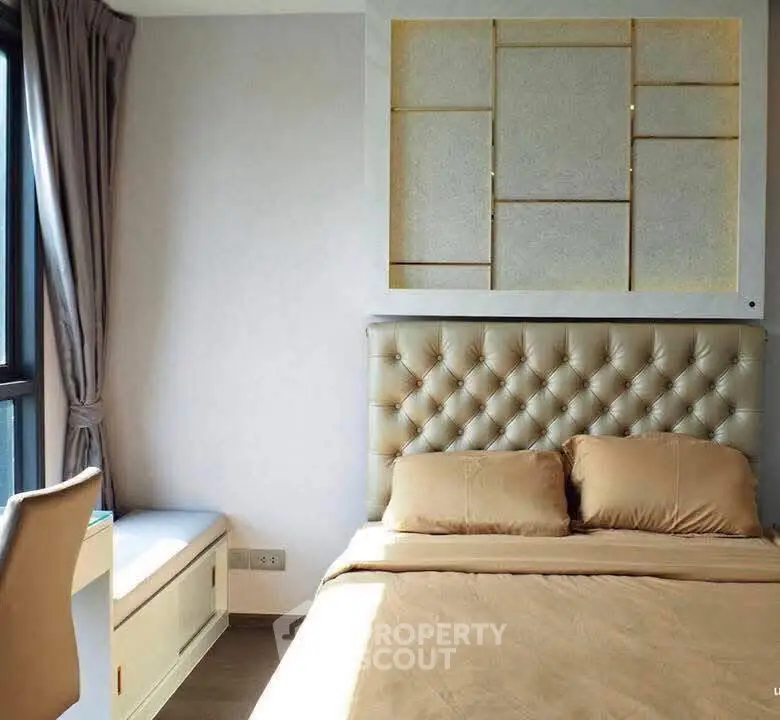 Luxurious bedroom with tufted headboard and elegant decor