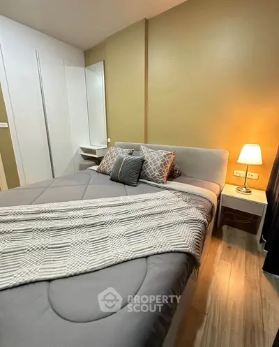 Cozy bedroom with modern decor and warm lighting