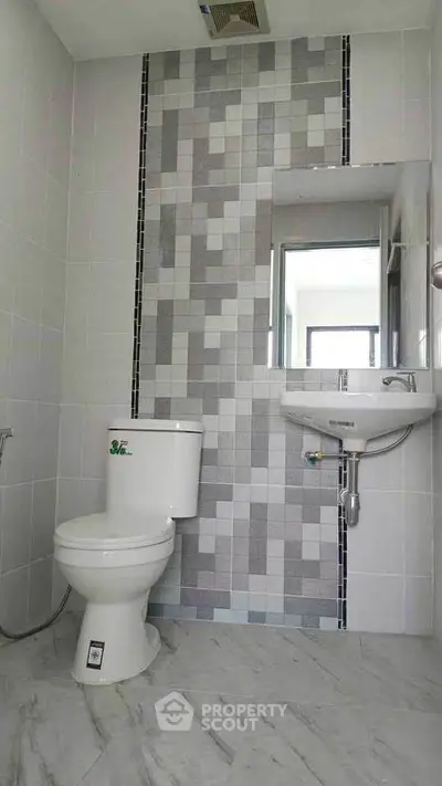 Modern bathroom with stylish tile design and sleek fixtures
