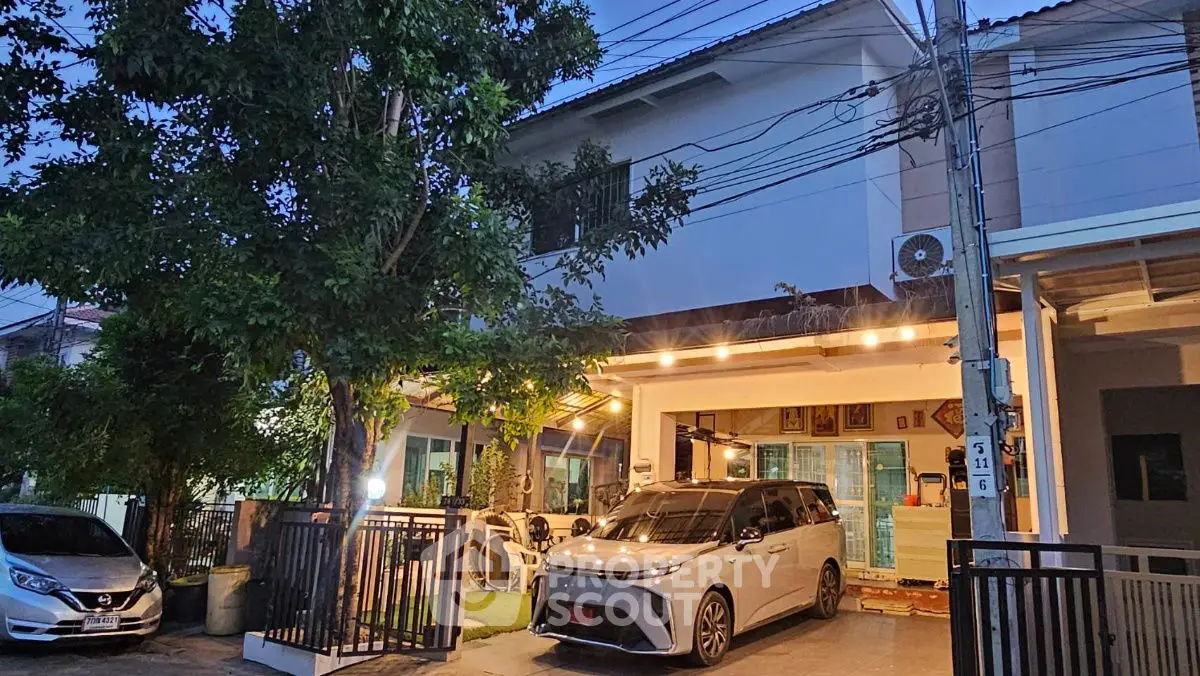 Charming suburban home with carport and lush greenery, perfect for family living.
