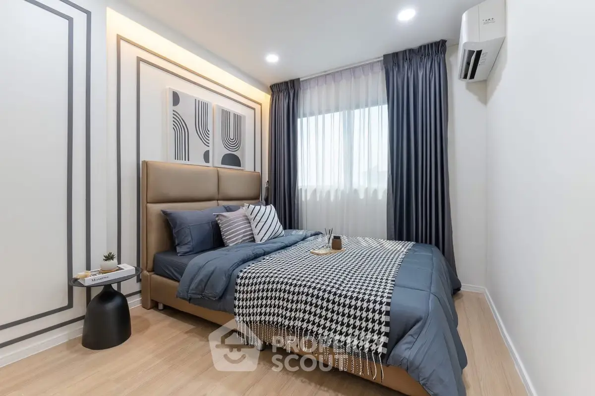 Modern bedroom with stylish decor and natural light